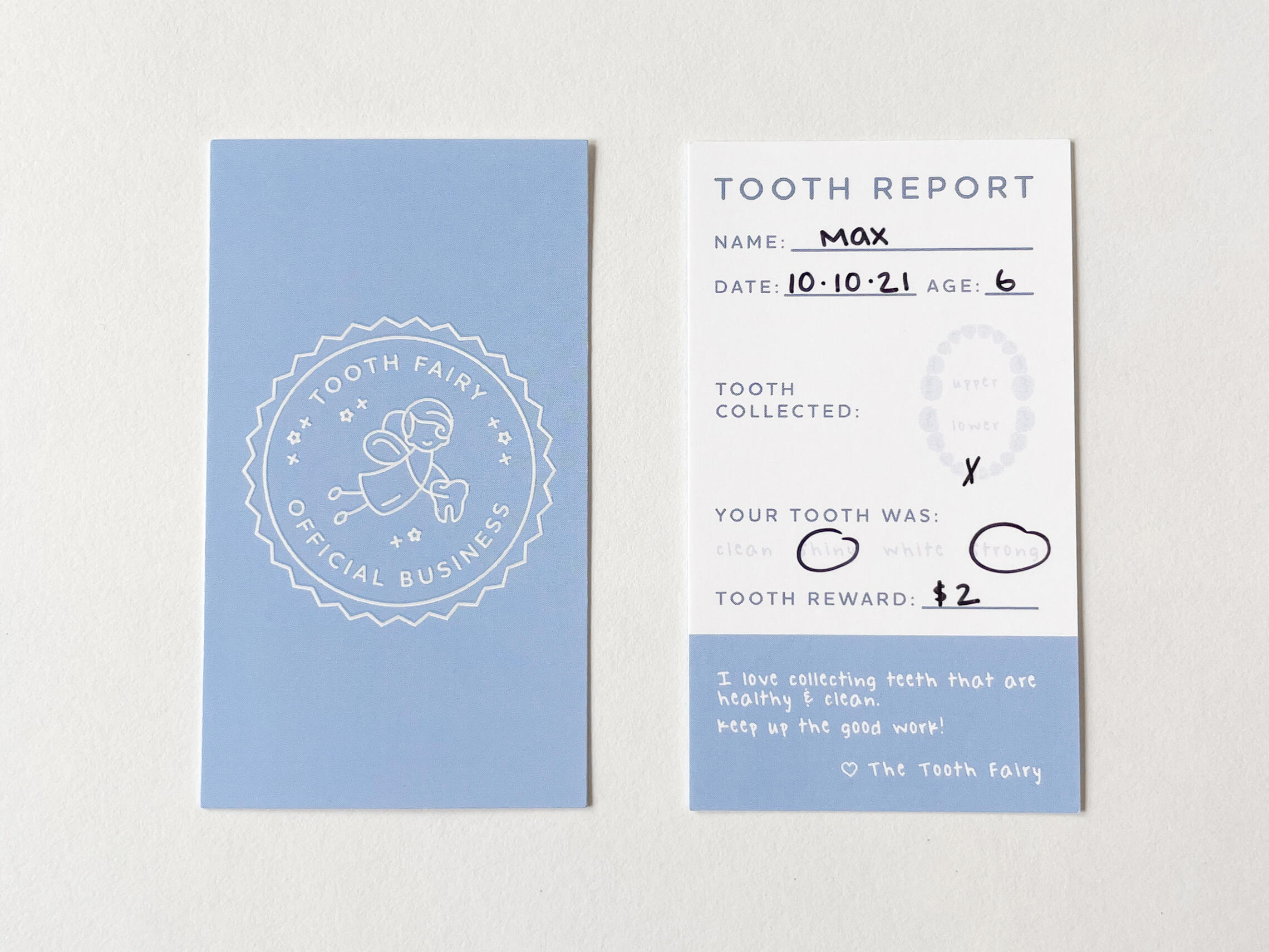 Front and back of the tooth fairy cards on a white background.